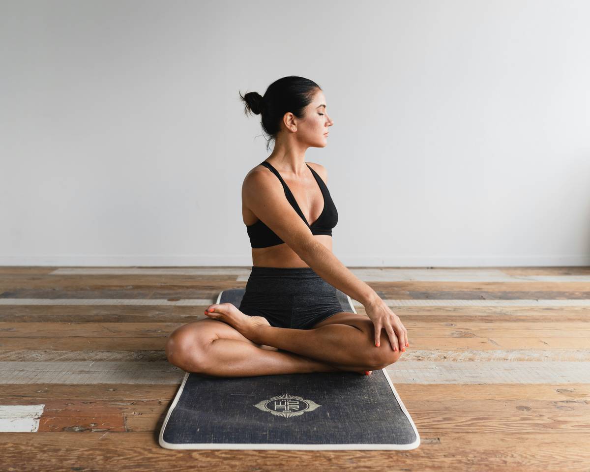 Close-up of eco friendly tpe yoga mat being wiped with microfiber cloth